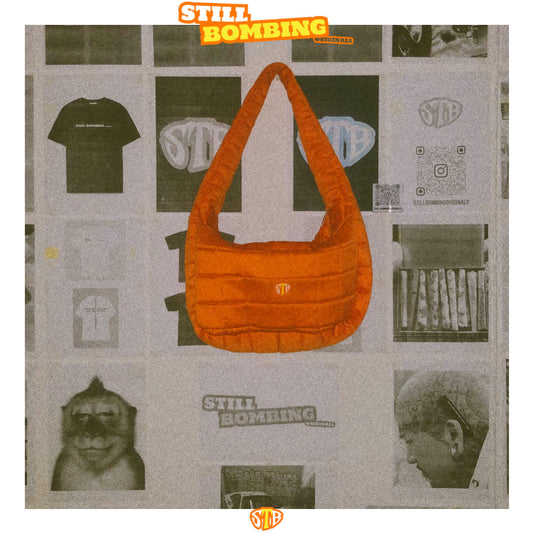 Still Bombing Originals Orange Puffer Bag.